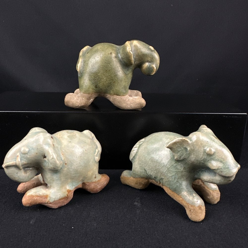 3 Sawankhalok ceramic small Thai crouching elephants, 14-16th Century