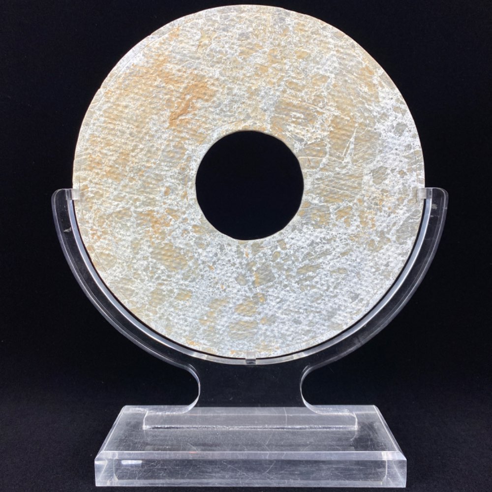 Semi-nephrite Bi disk from China of the Han dynasty (206 BC-220 AD)