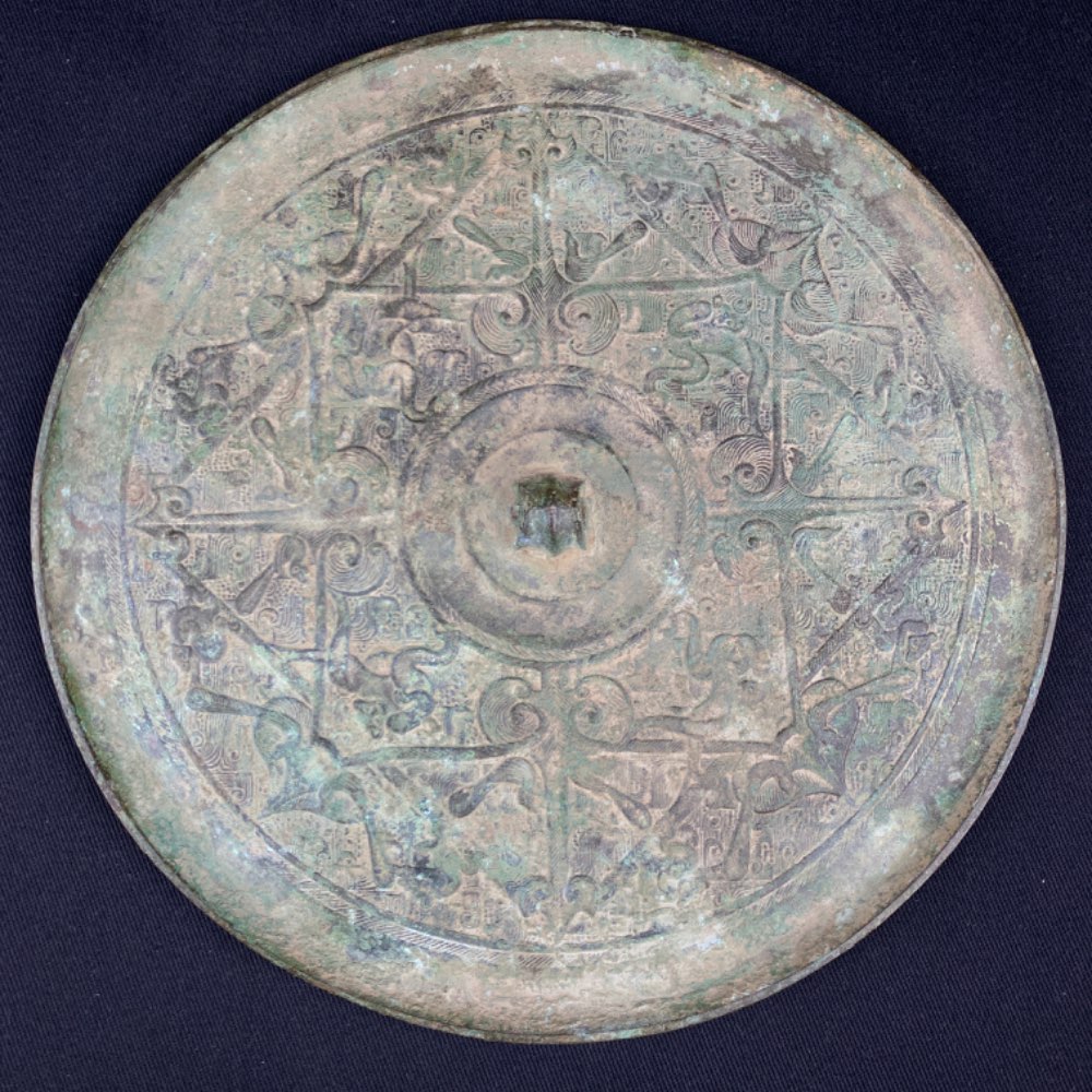 A unique bronze mirror of Han Dynasty with birds and monkeys