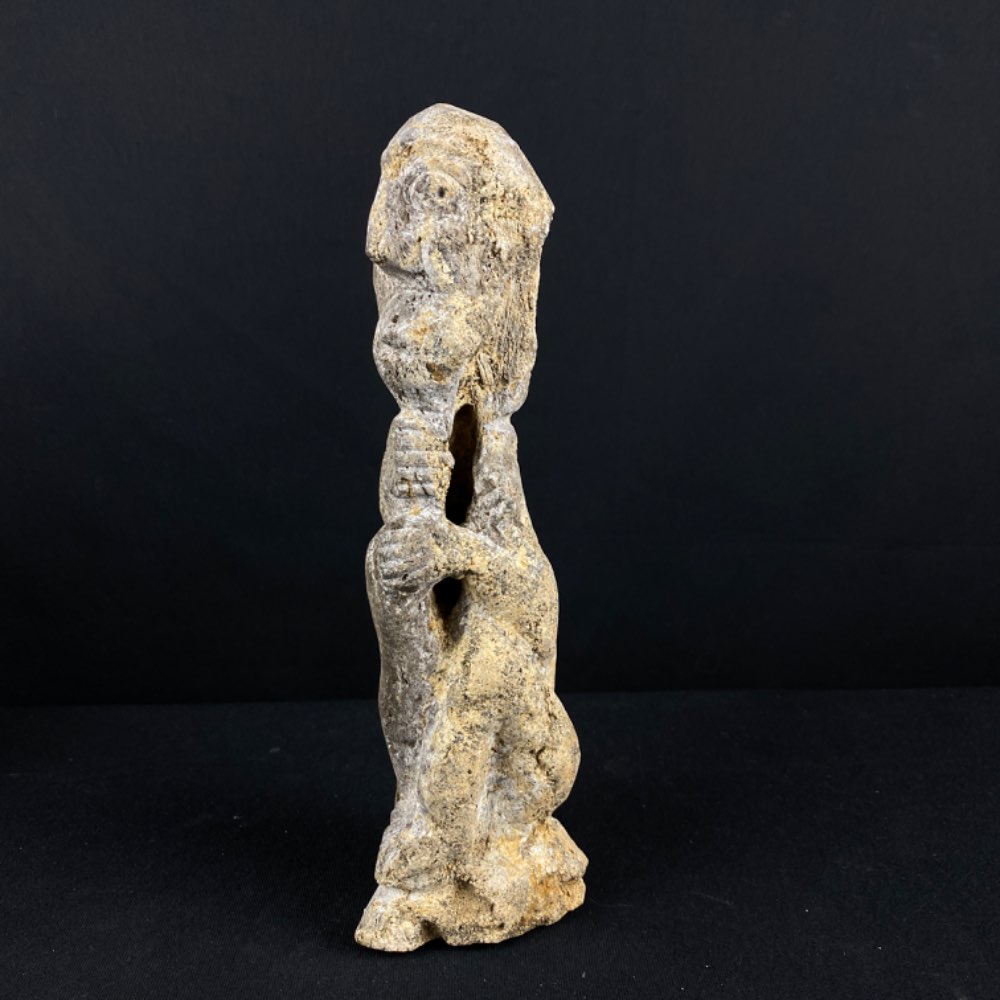 Mastodon mammoth fossilized bone with modern carving statue from Java, Indonesia